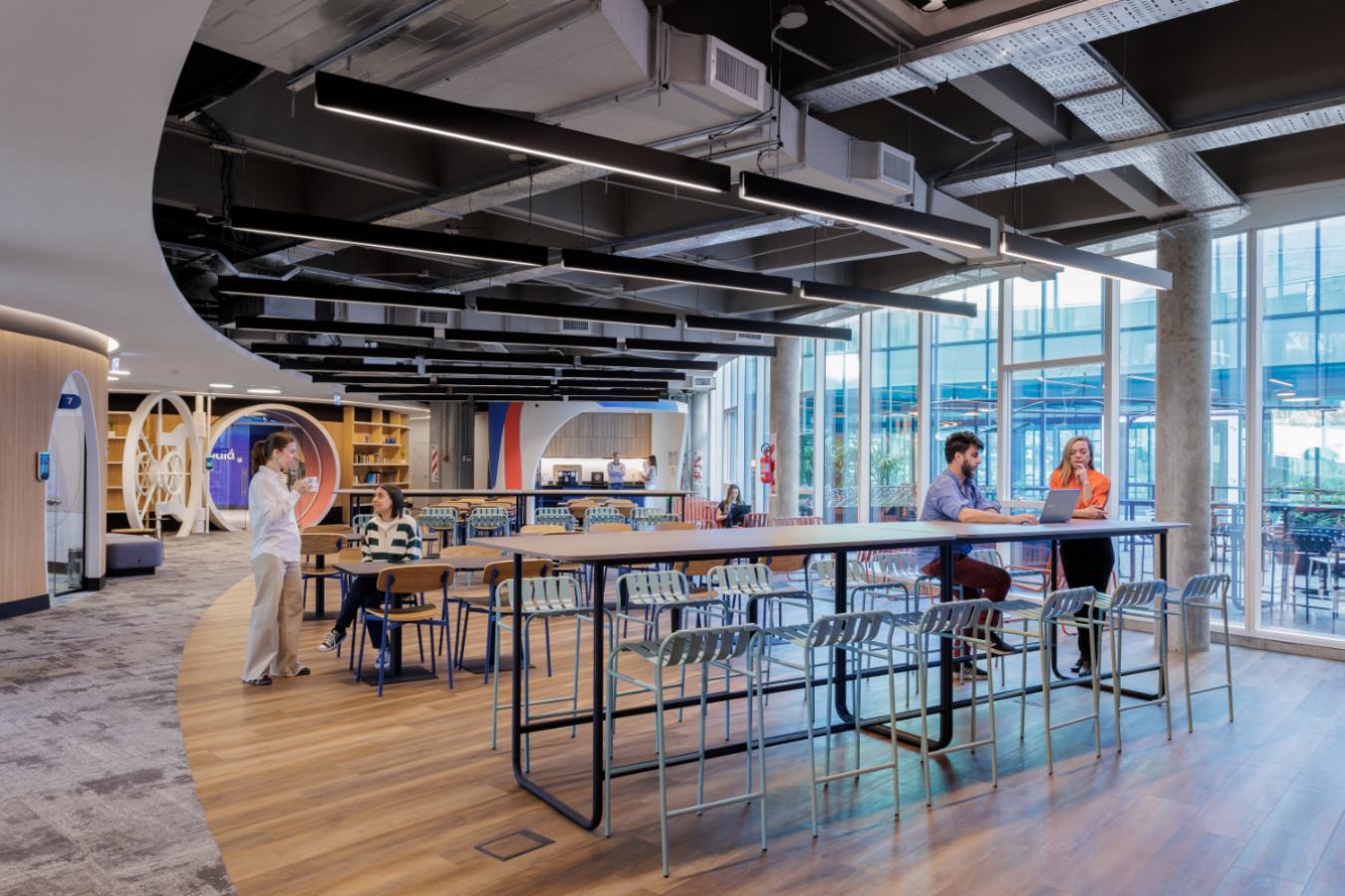 Uala Offices 2024 - Flexible work zone with metal frame shelving and abundant natural light - Contract Workplaces(1).jpg